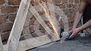 Sparks flying during the operation of the angle saw