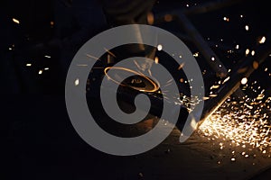 Sparks from the grinder. Metal cutting.