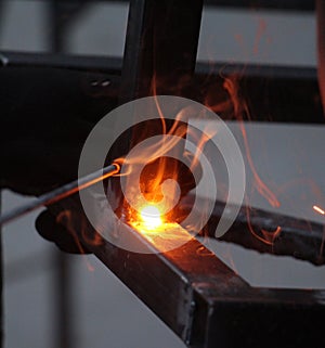 Sparks and jets of smoke when welding