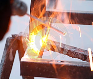 Sparks and jets of smoke when welding