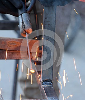 Sparks and jets of smoke when welding of steel structures