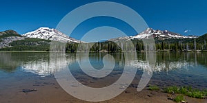 Sparks Lake with snow-capped mountains of the Cascade Range in Oregon