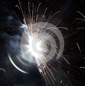 Sparks from metal welding at a construction site