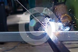 Sparks and smoke welding iron.