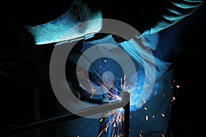 Sparks from welding. A man will weld metal. Workplace of the welder. Garage welder