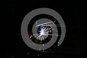 Sparks from welding. A man will weld metal. Workplace of the welder. Garage welder