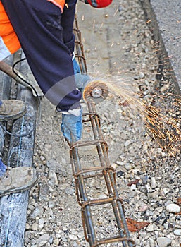 Sparks when worker cut a piece of iron with a flexible