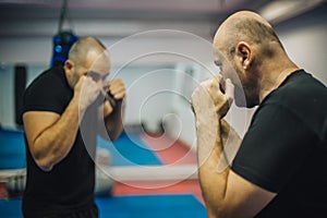 Sparring training and demonstration of street fight technique against attacker photo