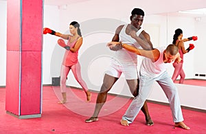 Sparring of two men at self-defense training in sports club