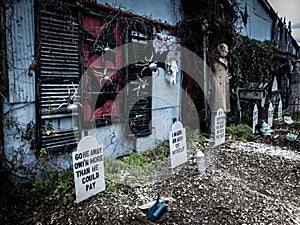 Funny Halloween decorations in front of a haunted house