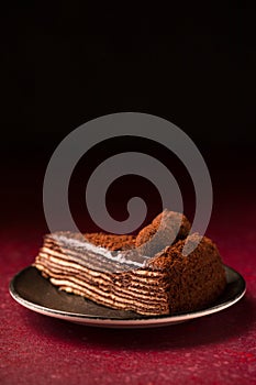 Spartacus chocolate cake on a burgundy background