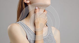 A spasm in the girl`s neck. Neck and back injuries, and fatigue at work. The zone of injury, the image on a blank background