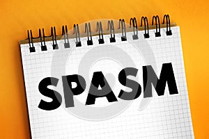 Spasm - sudden involuntary muscular contraction or convulsive movement, text concept on notepad