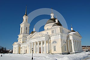 Spaso-Preobrazhensky Cathedral in the city of Nevyansk, bell tower and the leaning tower. Winter cityscape