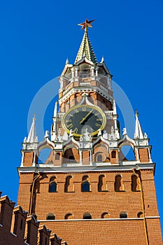 Spasskaya Tower Chiming Clock in Moscow Kremlin, Details of famous architecture building, closeup view, sunny day. photo