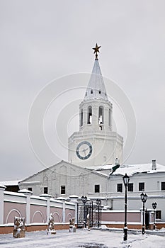 Spasskaya Tower in Kazan Kremlin on cloudy winter photo