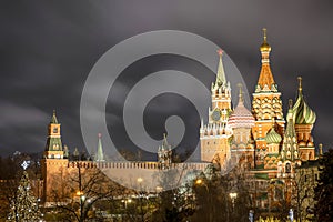 Spasskaya tower of the Kremlin and St. Basil`s Cathedral in night - Moscow, Russia, 17 01 2020
