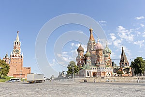 Spasskaya Tower of Moscow Kremlin and Saint Basil`s Cathedral