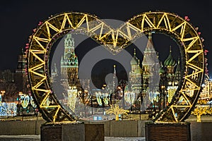 Spasskaya Tower and St. Basilâ€™s Cathedral Framed by Illuminated Love Heart at Night