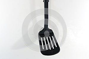 A spatula, also pan knife, slot turner,