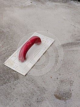 Spatula on a concrete sidewalk background