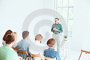 Speaker at Business Meeting in the conference hall.