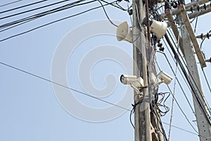 Speaker and cctv on electricity pole