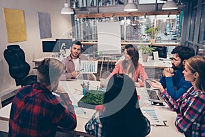 Speaker on financial seminar showing diagrama to his colleagues photo