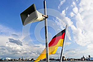 Speaker and german flag on a boat