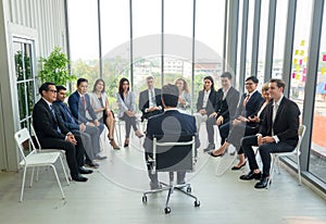 Speaker Giving a Talk at Business Meeting. Audience in the conference hall. Business and Entrepreneurship. Panoramic composition