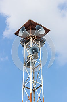 Speaker on high tower clear blue sky