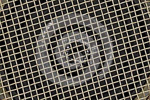 Speaker metallic grid close up