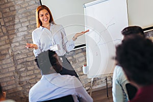 Speaker talking in seminar with many of audiences