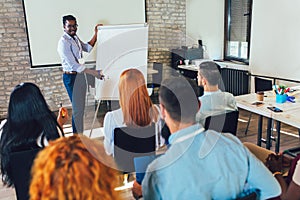 Speaker talking in seminar with many of audiences for business meeting