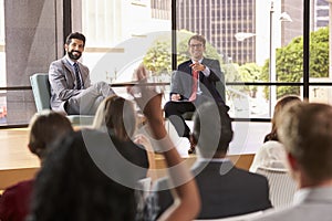 Speakers at a business seminar take questions from audience