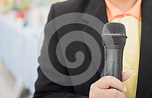 Speaking with microphone in Seminar Conference Concept : hands holding businesspeople speech  with microphones in meeting room,