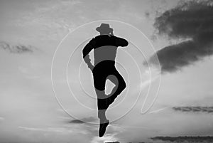 speaking on phone. man silhouette jump on sky background. confident businessman jumping. daily motivation. enjoying life