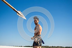A spear aimed at a Spartan warrior with a spear photo