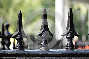 Black spearheads on a fence