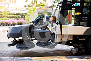 The special car cleans city road. Detail of a street sweeper machine