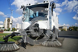 A special car - a vacuum cleaner and a sweeper for cleaning city streets. Landscaping and urban economy