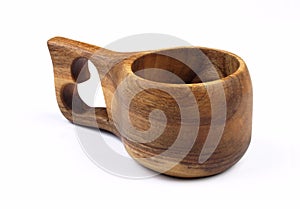 Special cup made of wood with heart . Household kitchen utensils of walnut wood for drink