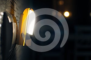 Special device connects power source and lit only when its dark at night to see switch for night walkers solution concept