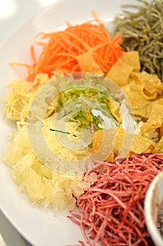 A special dish during Chinese New Year called Yusheng or Yee Sang