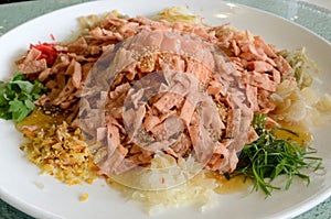 A special dish during Chinese New Year called Yusheng or Yee Sang