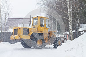 Special equipment clears snow in the park in winter