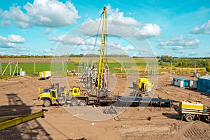 Special equipment for drilling an oil well in an oil field. Workover rig working on a previously drilled well trying to restore photo