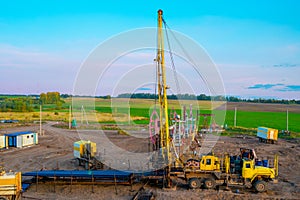 Special equipment for drilling an oil well in an oil field. Workover rig working on a previously drilled well trying to restore