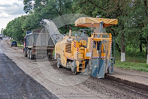 Special equipment removes removes destroyed road surface