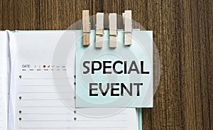 Special Event notes paper and a clothes pegs on wooden background